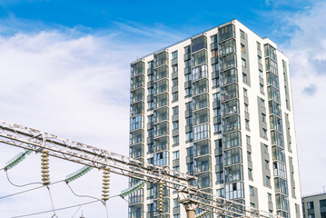 Glass insulators are installed on the power lines. Electrical substation for receiving, converting...