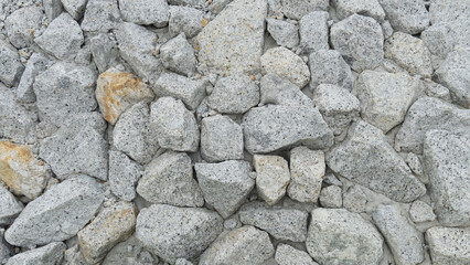 Above view of gravel texture. Pebble stone background. Light grey closeup big rocks. Make for wall of beside road background.
