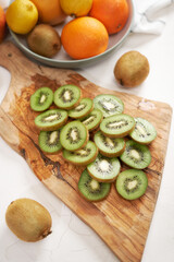 Fresh Sliced organic kiwi on wooden cutting board