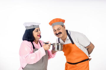 Indian happy chefs or cooks couple on white background