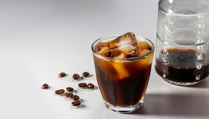 Cold black coffee with ice cubes on a white background. Coldbrew. Summer drinks.