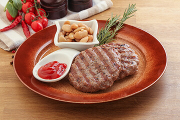 Grilled beef burger cutlet with sauce