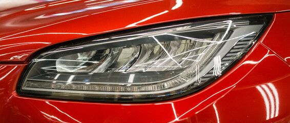 Modern Car exterior details.Headlight of a modern sport car close-up. 