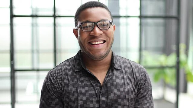 african american man in blurred office closeup