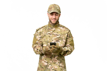 Military man over isolated chroma key background sending a message with the mobile