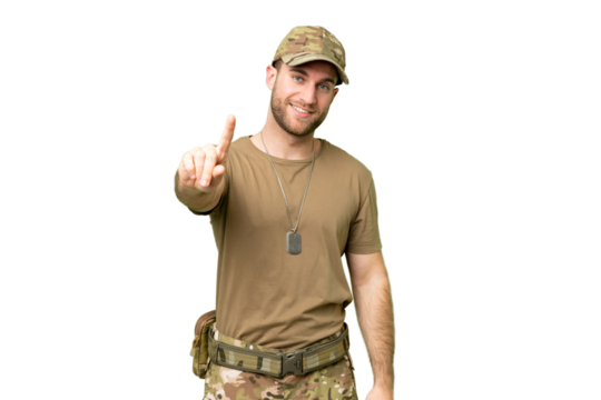 Military with dog tag over isolated chroma key background showing and lifting a finger