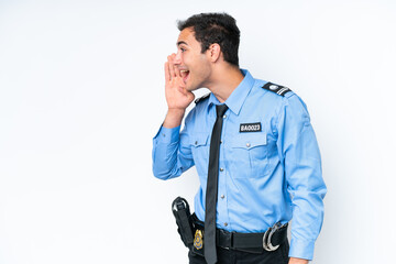 Young police caucasian man isolated on white background shouting with mouth wide open to the lateral