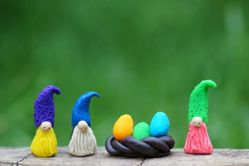 Figurines of fairy gnomes with Easter eggs.