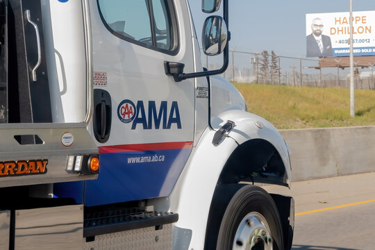 Calgary, Alberta, Canada. Aug 4, 2023. A close up to a CAA Alberta AMA towing truck on the route during summer.