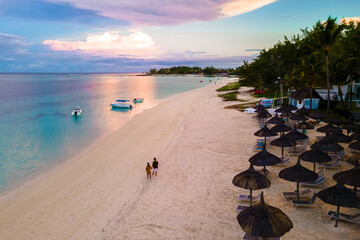 Man and Woman on a tropical beach in Mauritius, a couple on a honeymoon vacation in Mauritius