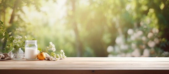 A blurred summer kitchen window background with a bleached wooden table top