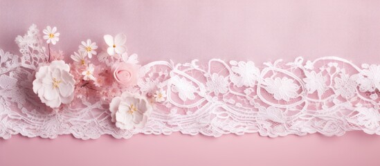 A close-up photograph of a beautiful white lace cloth on a pink background. detailed floral pattern