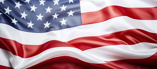 A close-up photograph shows a section of the American flag on a white background. There is space