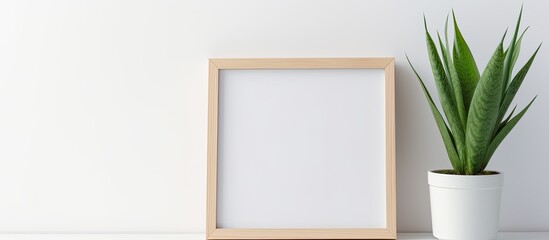 A minimalist home interior is depicted in the photo, showcasing an empty white wooden photo frame