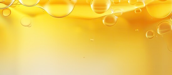 Abstract background banner with various yellow bubbles of oil or serum, providing copy space....