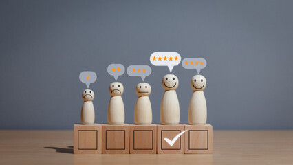 Wooden puppet on table, smiley face with check mark and star icon Comment on satisfaction rating or good experience and positive feedback, concept of satisfaction and customer service - obrazy, fototapety, plakaty