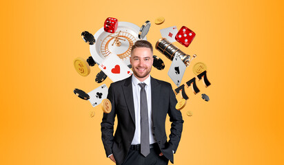 Smiling businessman with hands in pocket, casino slot machine and poker