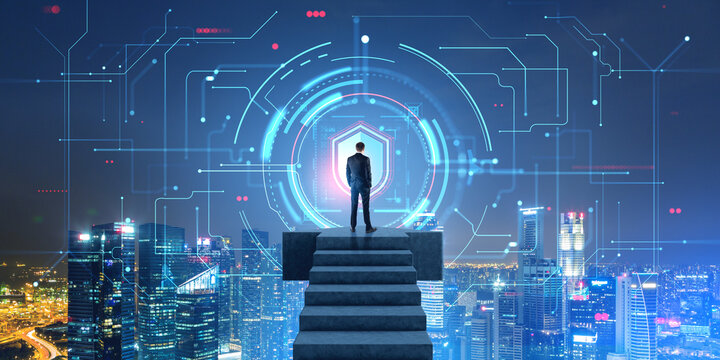 Man on stairs looking at cyber security interface in night city