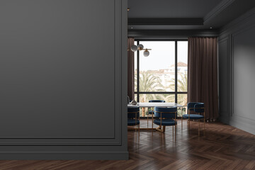 Gray dining room interior with blank wall