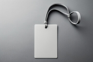 Empty layout layout on grey background, Common blank label name tag hanging on neck with thread