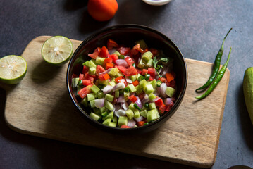 Close up of mixed green salad in a bowl. Selective focus.