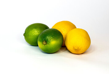A fresh lemons and a limes  isolated on a white background.
