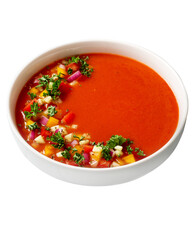 Spanish tomato gazpacho cold soup styled and decorated in white plate, isolated, top view