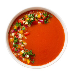 Isolated gazpacho cold tomato soup, styled and decorated in white plate, top view