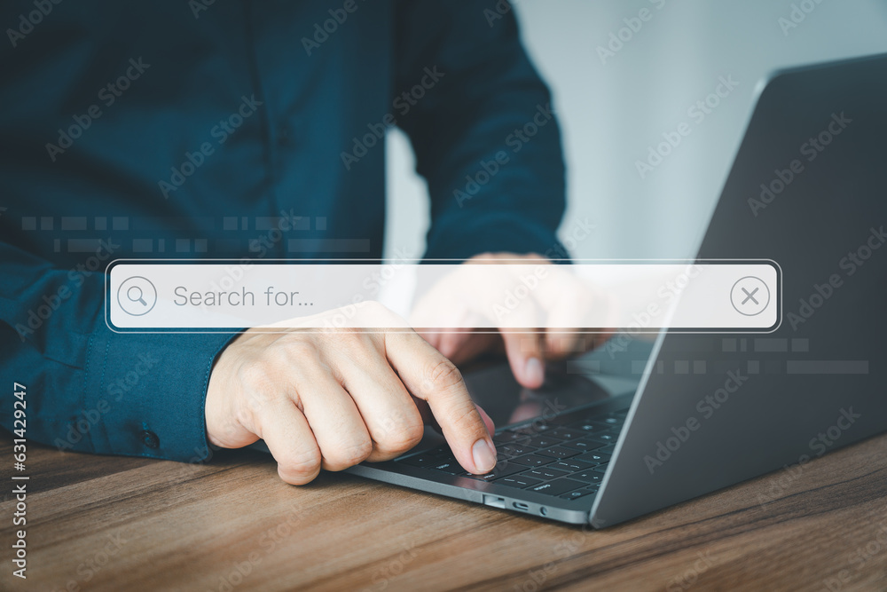 Aufkleber Man working with laptop computer on table in office. Search engine optimization the internet with search bar. Best SEO technology networking, Searching browsing internet data information concept.