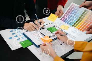  UX developer and ui designer brainstorming about mobile app interface wireframe design with...