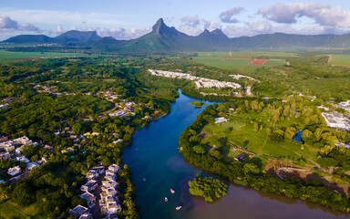 fishing boats resting at tamarin bay, Mauritius island, indian ocean, Africa with Tamarin mountain on the background