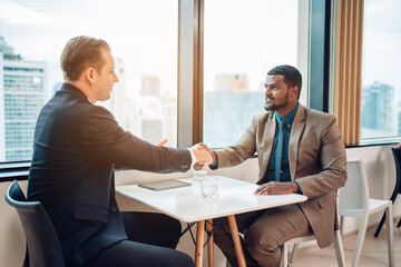 Fototapeta premium Professional business people are working and shaking hands while working in the creative office.