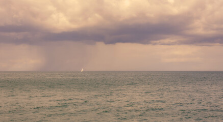Seascape and rain cloud.