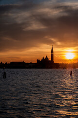 Fototapeta premium Panoramic view of Saint Mark’s Basilica and a cloudy sunset in Venice Italy