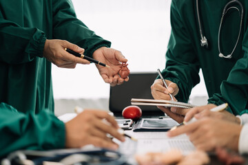 Medical team working on digital tablet healthcare doctor technology tablet using computer analyzed the results of medical reports, an online conference at the hospital.
