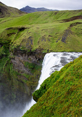 Famous icelandic waterfall Skogafoss in the mountains on Iceland