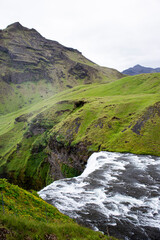 Naklejka na ściany i meble Famous icelandic waterfall Skogafoss in the mountains on Iceland