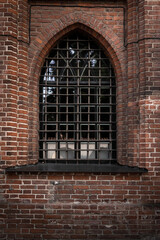 window in a old brick wall. Vintage architecture