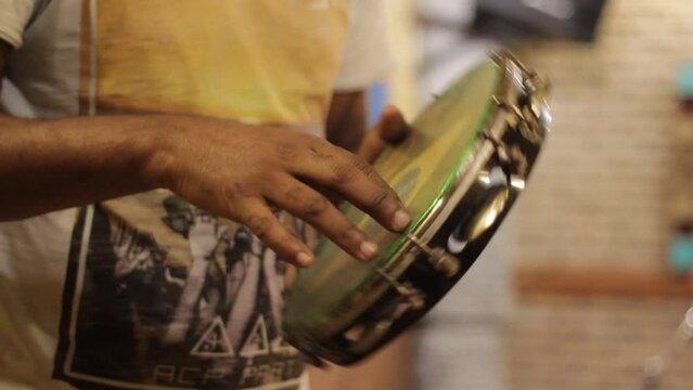 playing tambourine, percussion instrument