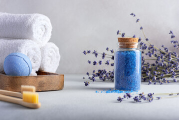 Homemade lavender bath salt in glass jar and bathroom accessories