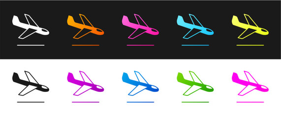 Set Plane landing icon isolated on black and white background. Airplane transport symbol. Vector