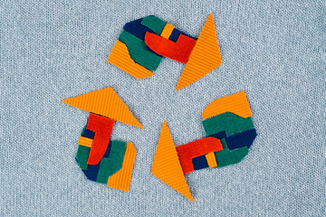 Creative textile waste recycling symbol. Eco-friendly fashion. Sustainability choices apparel. top...