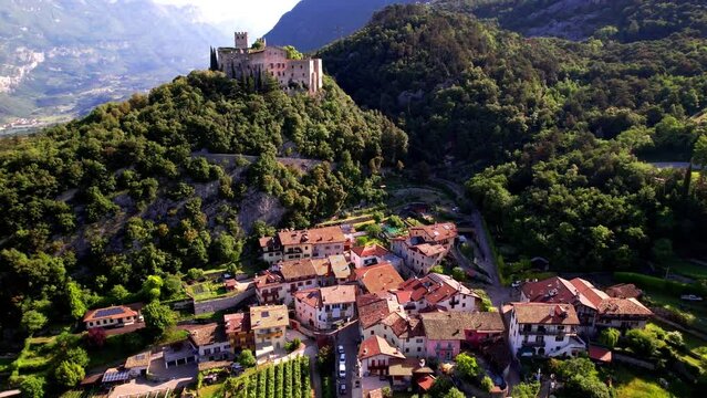 Italy travel destinations. Famous medieval castle Madruzzo in Trentino Alto Adige region province of Trento. Aerial panoramic drone video