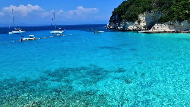 Most beautiful beaches of Greece - Vrika Beach in Antipaxos. Cinematic View of Stunning Turquoise Crystal Sea and White Sand. Ionian greek Islands
