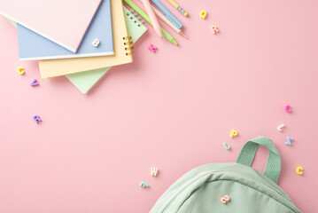 Stylishly curated girlish stationery concept. Overhead shot of stationery items, sage backpack,...