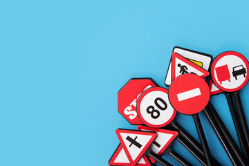 fines for traffic violations, traffic regulations, road signs on a blue background, copy space