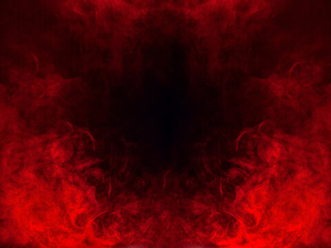 Red smoke or flame texture on a black background. Texture and abstract art	