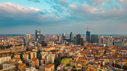 Aerial view of the skyline of a modern cityscape of business skyscrapers. Palazzo Lombardy Region, unicredit tower and UnipolSai, vertical forest. Biblioteca degli Alberi Drone. Milan Italy. - obrazy, fototapety, plakaty
