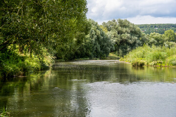 river in the mountains with blue sky, beautiful sunny day in natur