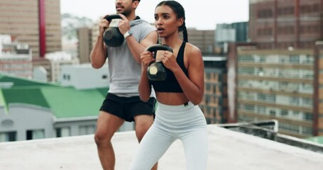 Exercise, people and coach on rooftop with kettle bell, squats and workout in city outdoor. Personal trainer, strength training and motivation of woman and man on roof with sports weight for fitness - Powered by Adobe